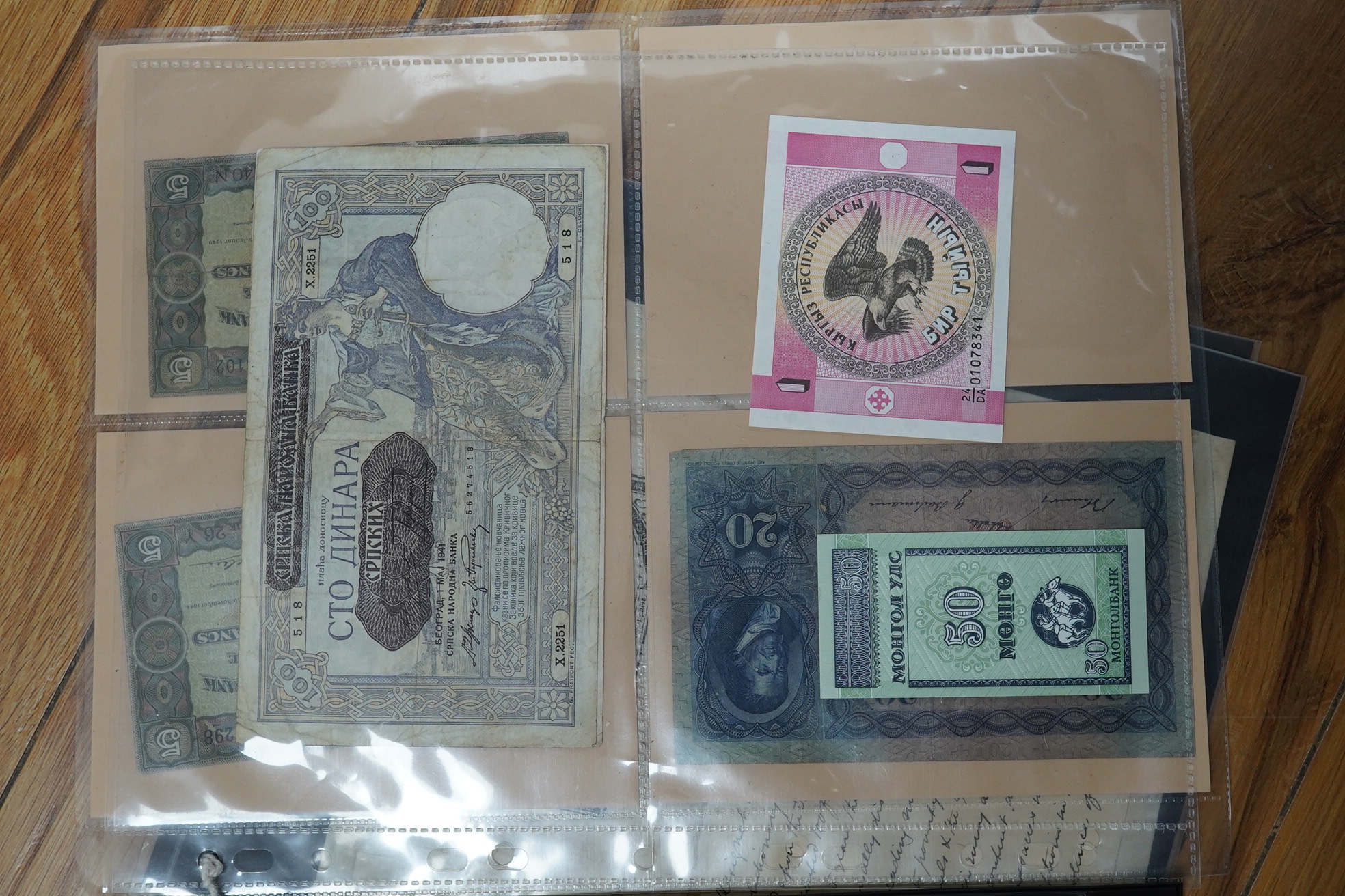 A collection of assorted world issue paper money including 1922 German doeskin, 1937 USSR Lenin, Malta P.11 1939, Zimbabwe, French Revolution British Government Forgery, 1878 Bank of Madras and Japanese.